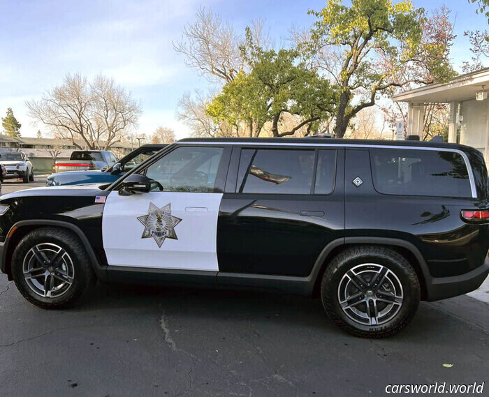 Primer coche patrulla de Rivian entra en servicio en el patio trasero de Tesla | Carscoops